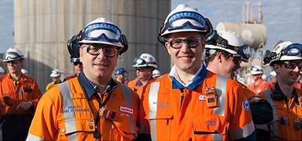 Workers standing together Workers standing together